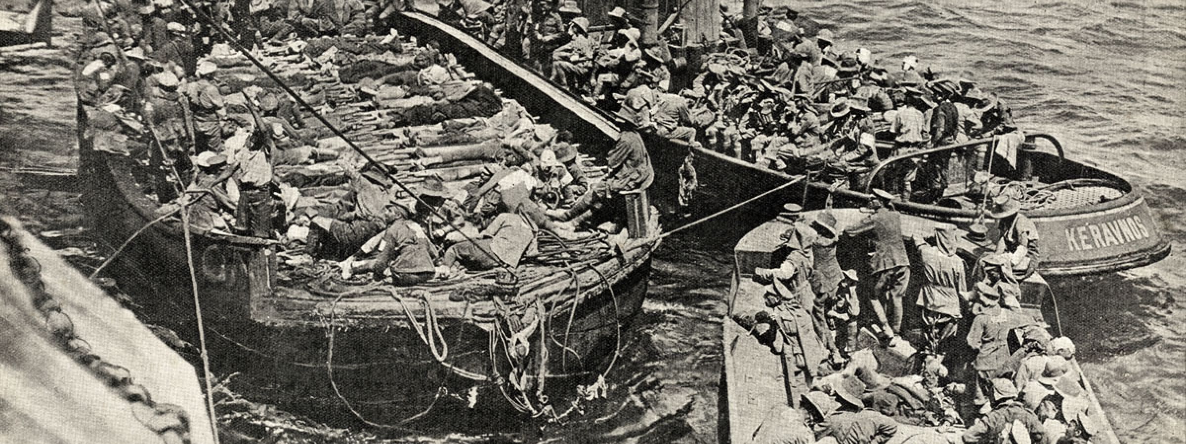 Wounded being brought along side an unidentified hospital ship off Gallipoli. A good view of the barges and the lighter towing them. There look to be a number of walking sick and wounded as well as stretcher cases